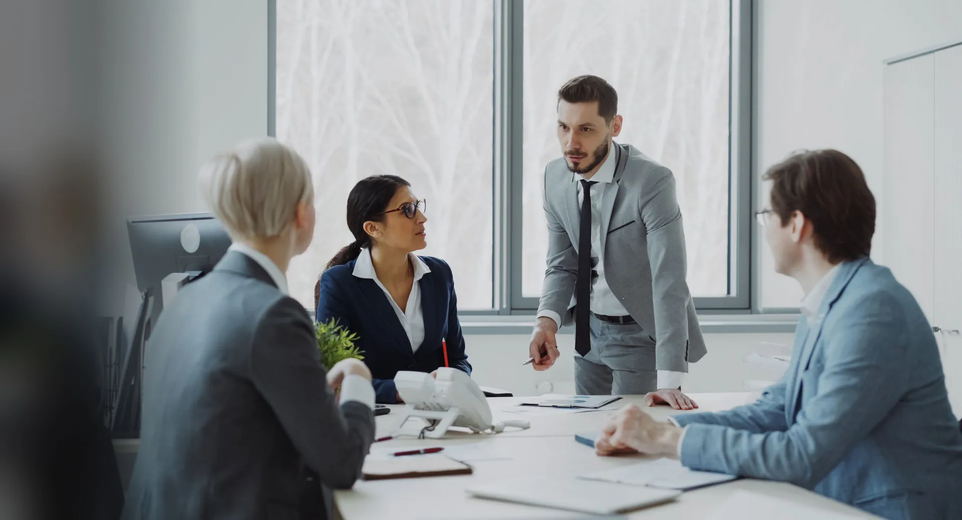 A city manager meets department heads around a conference table.